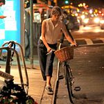 This is good bike behavior! Keira Knightley, while filming "Can A Song Save Your Life?" last year, walks her bike to a rack.